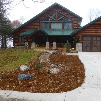 Seasonal mulch refresh landscaping in Loretto MN renewing garden beds for a clean and polished outdoor look
