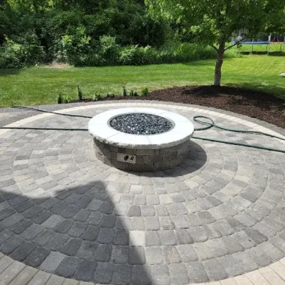 Stone fire pit construction in Loretto MN building durable and attractive outdoor features for relaxation
