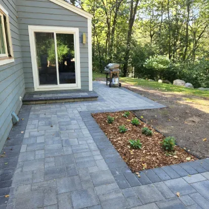Stone walkway design in Loretto MN enhancing curb appeal with durable and decorative garden pathways