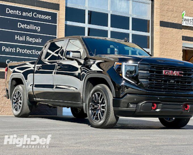 Black GMC Sierra truck with paint protection film in Goshen shielding it from road salt