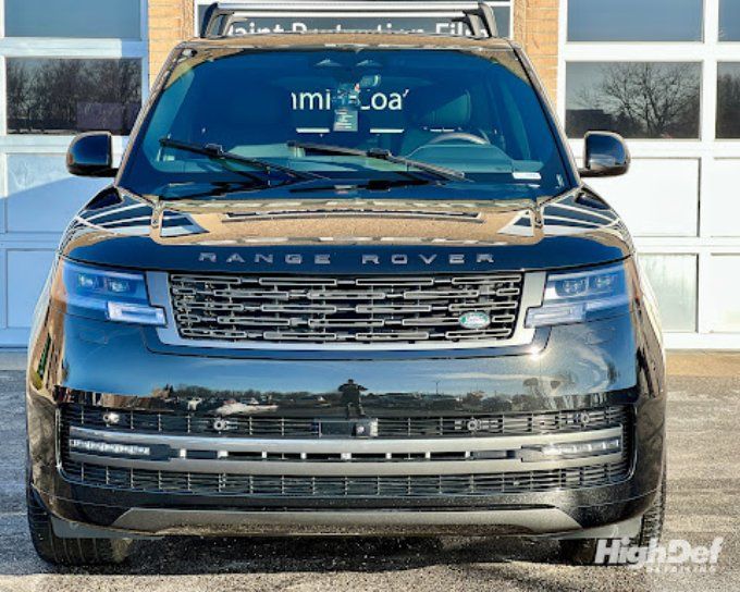 Black Range Rover SUV with auto window tinting in Bristol blocking harsh autumn sun
