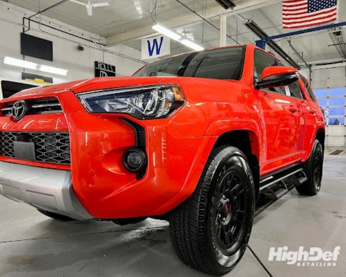 Orange Toyota 4Runner with paint protection film in Goshen ready for fall harvest roads
