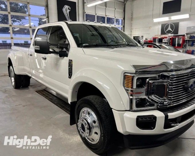 White Ford Super Duty dually truck showing auto window tinting film types for cars