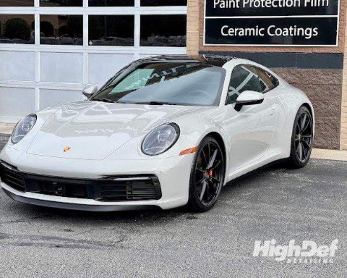 White Porsche 911 with auto window tinting in Bristol easing low autumn sun glare