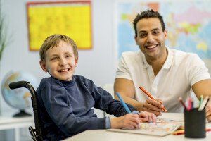 Man with boy in wheelchair