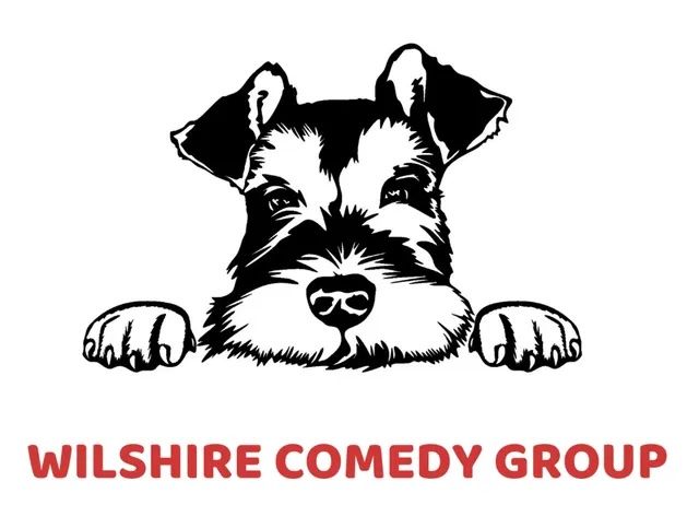 Schnauzer dog peeking over a line with
