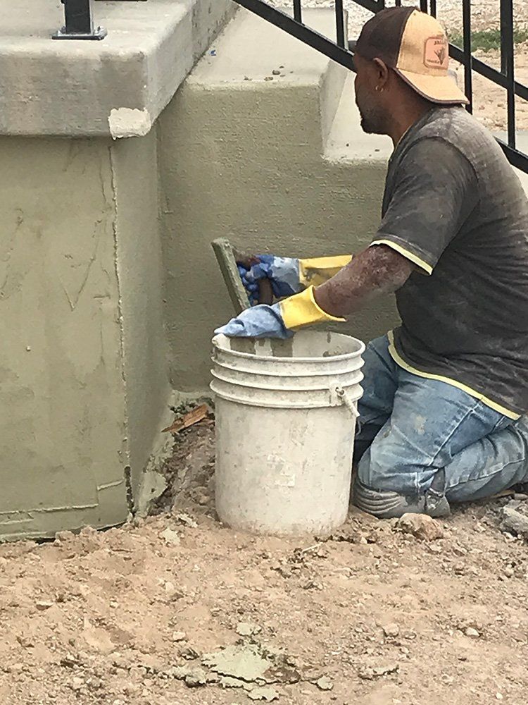 Man Working on House Foundation — Layton, UT — H & C Foundation Plastering