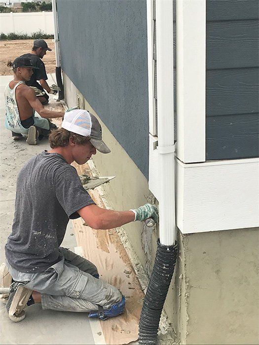 Three Workers Working on Foundation Plastering — Layton, UT — H & C Foundation Plastering