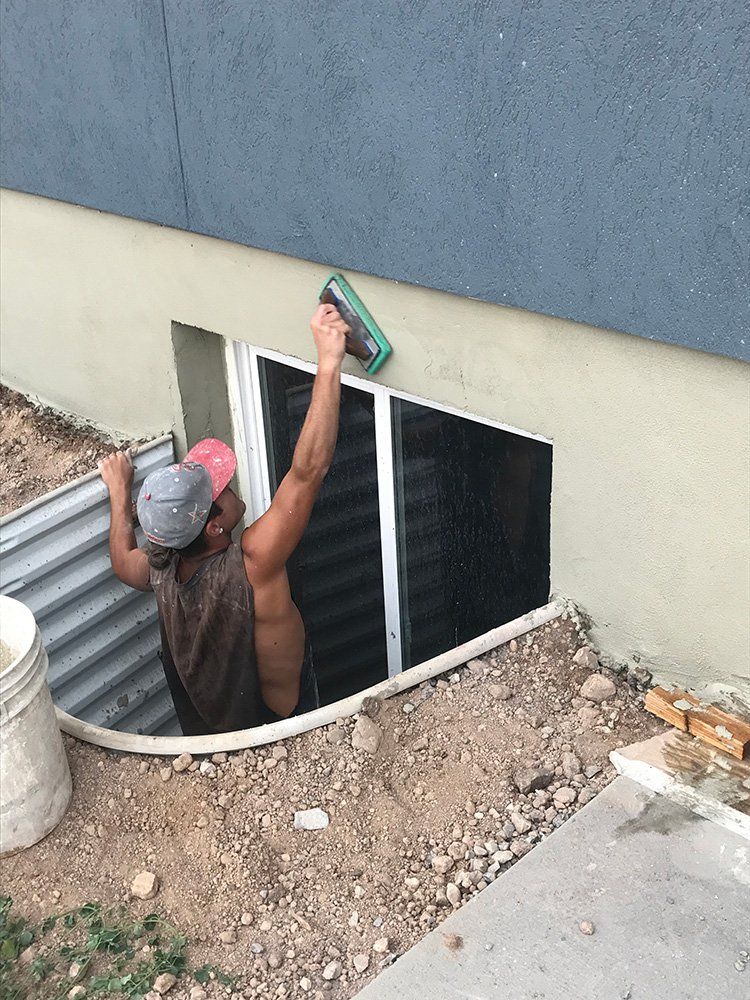 Man Working on House Siding — Layton, UT — H & C Foundation Plastering
