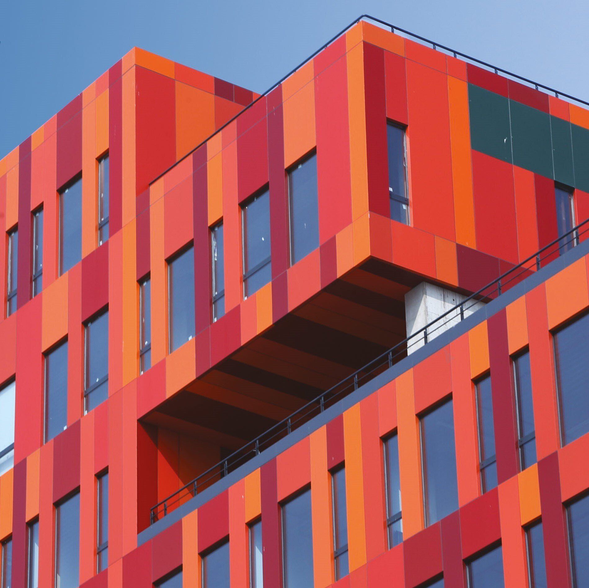 Orange and Red Alpolic Panels on Building