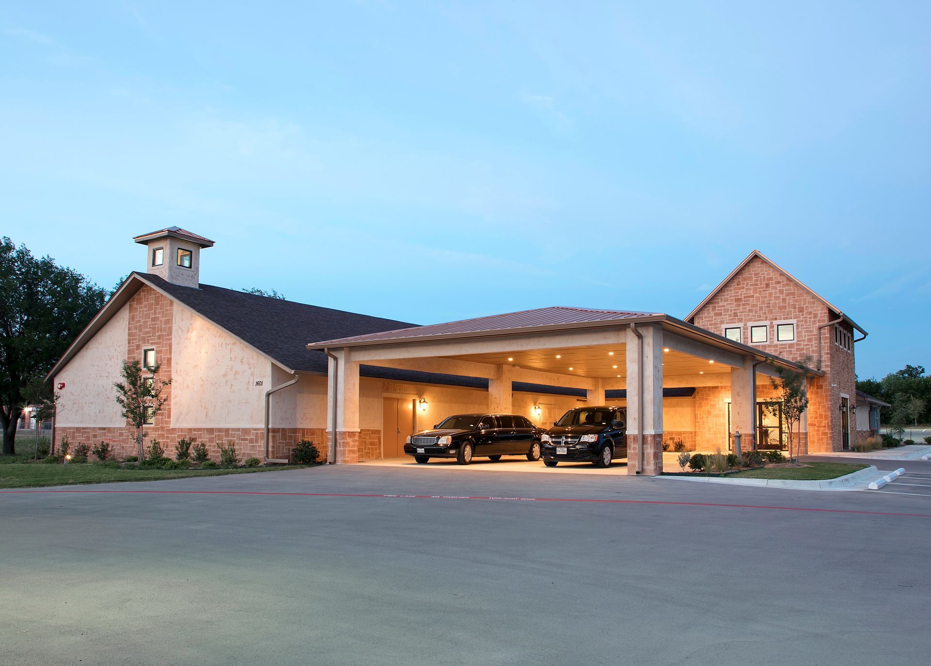 A lucas funeral home with a sign in front of it