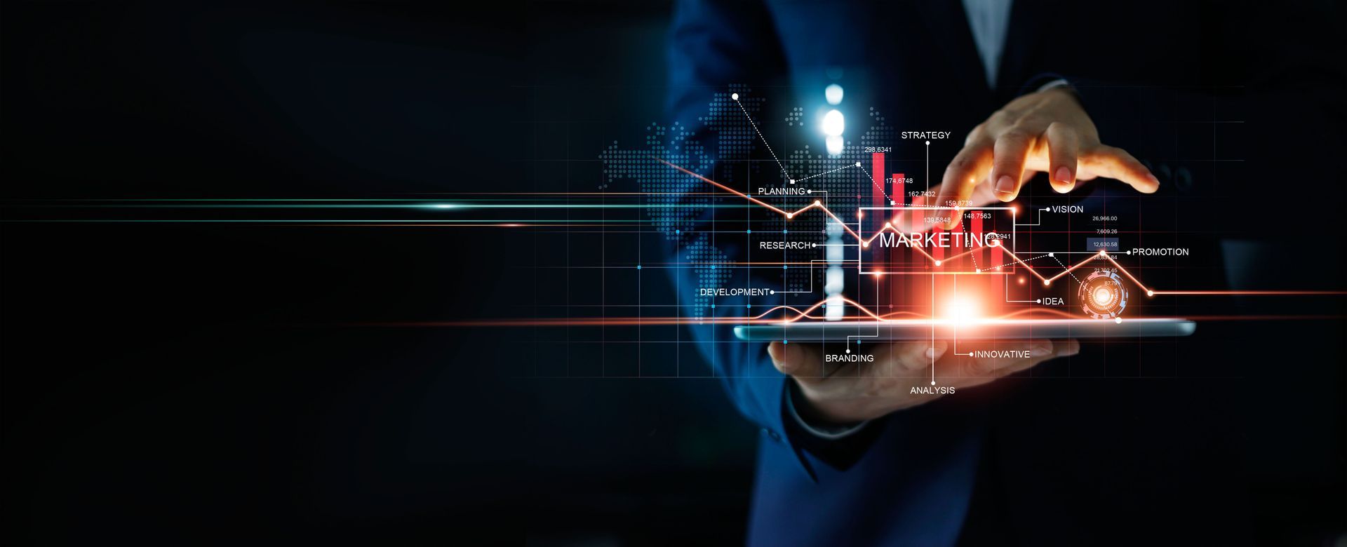 A man in a suit is holding a tablet with a glowing screen.