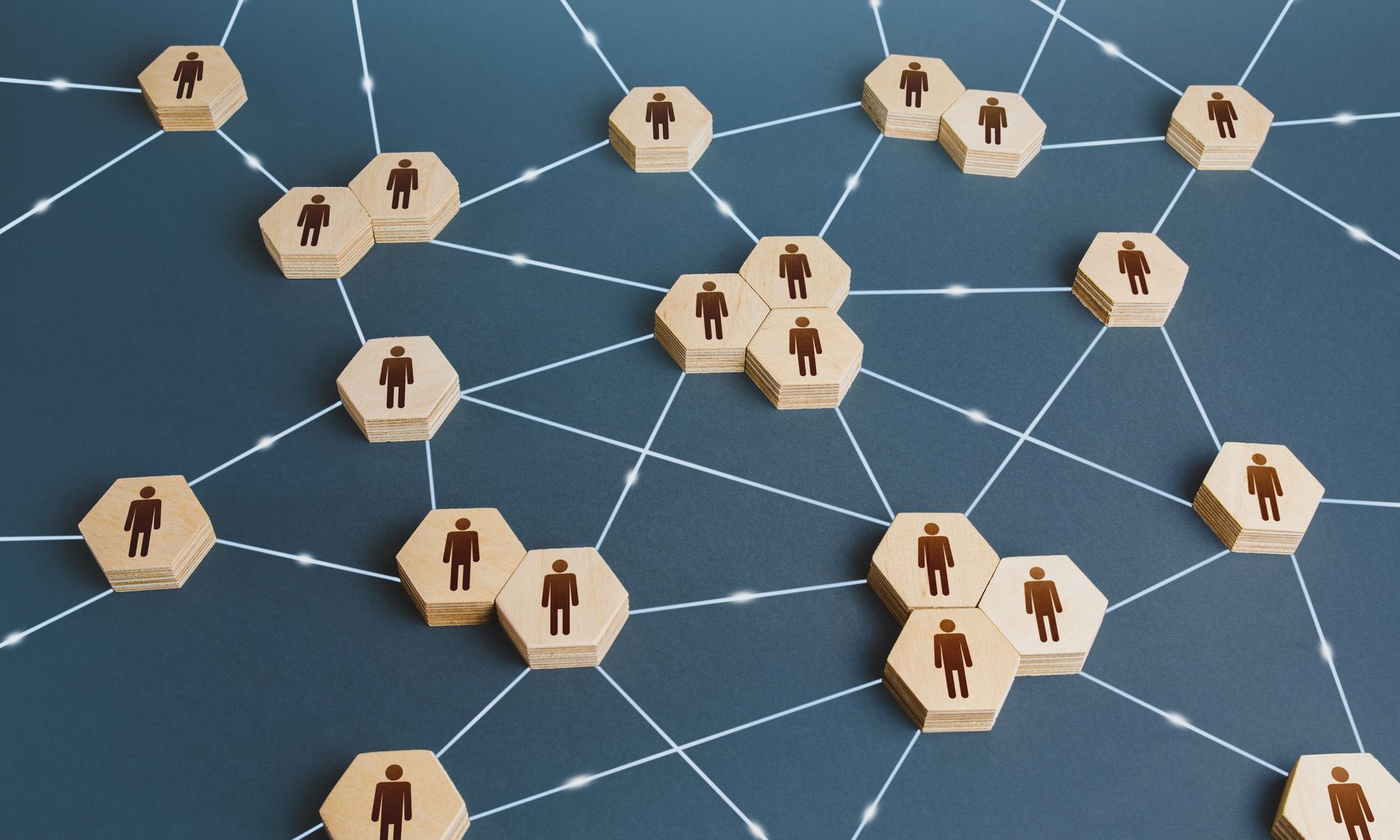 A group of wooden blocks with people on them are connected to each other.
