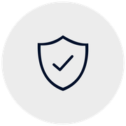 Shield icon with a checkmark, on a gray circular background.