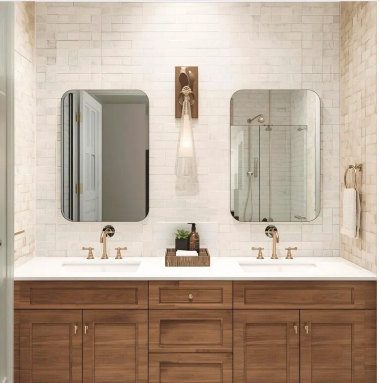 Modern bathroom vanity with twin mirrors, white tile walls, and a wood cabinet countertop sink.