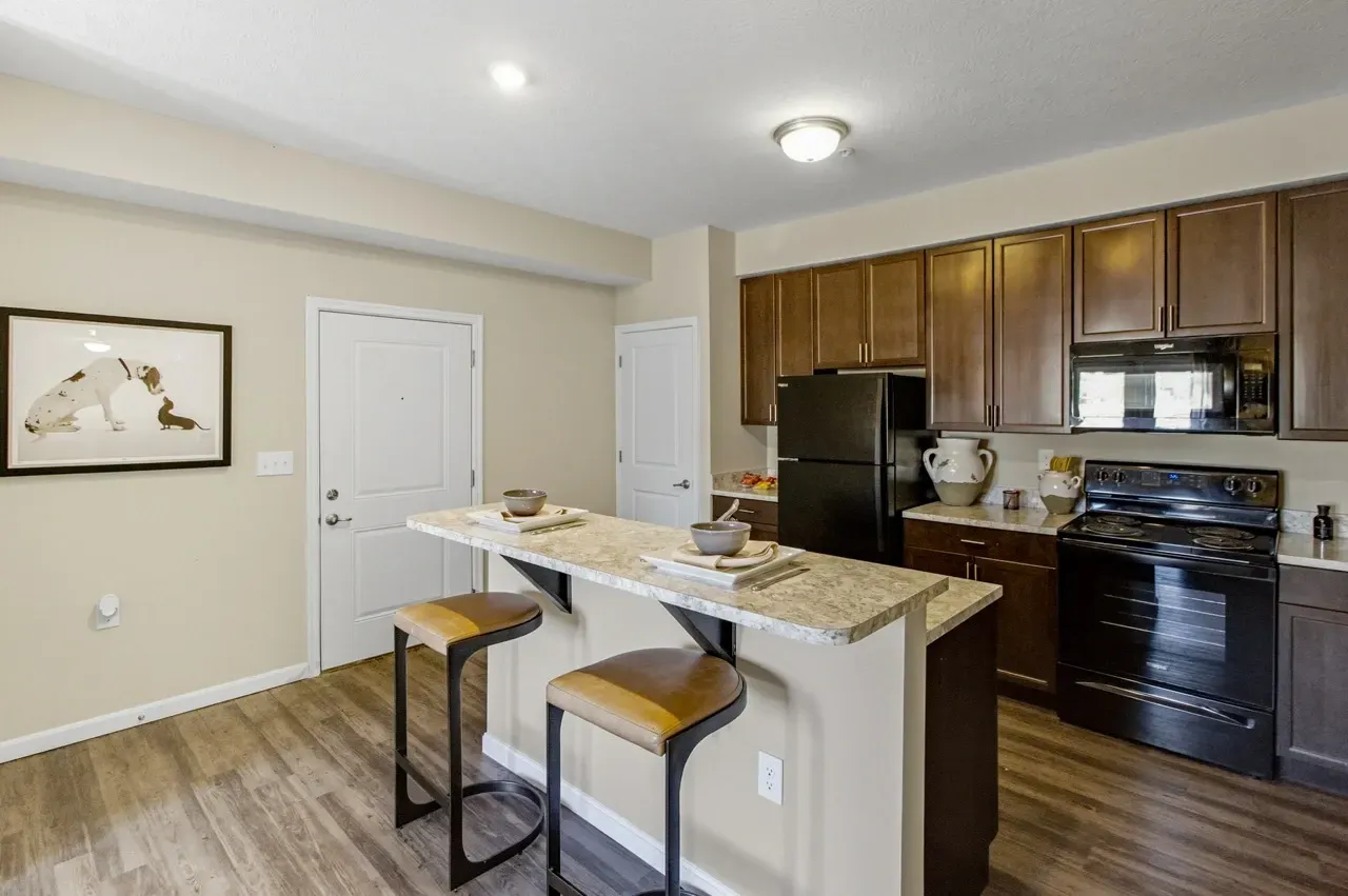 Kitchen with island and bar stools