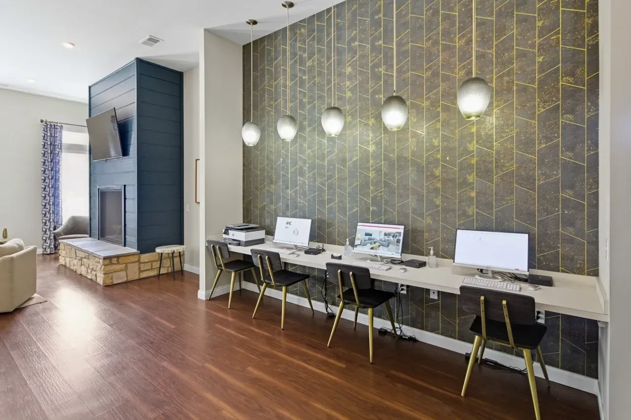 Business center with computers and printer.