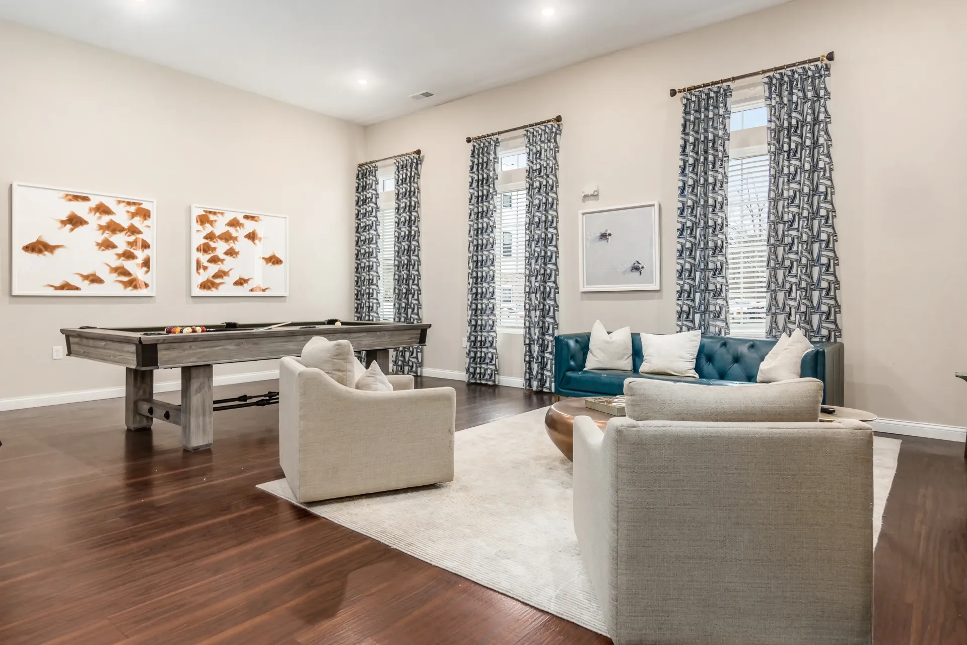 Clubhouse lounge area with a pool table and seating.
