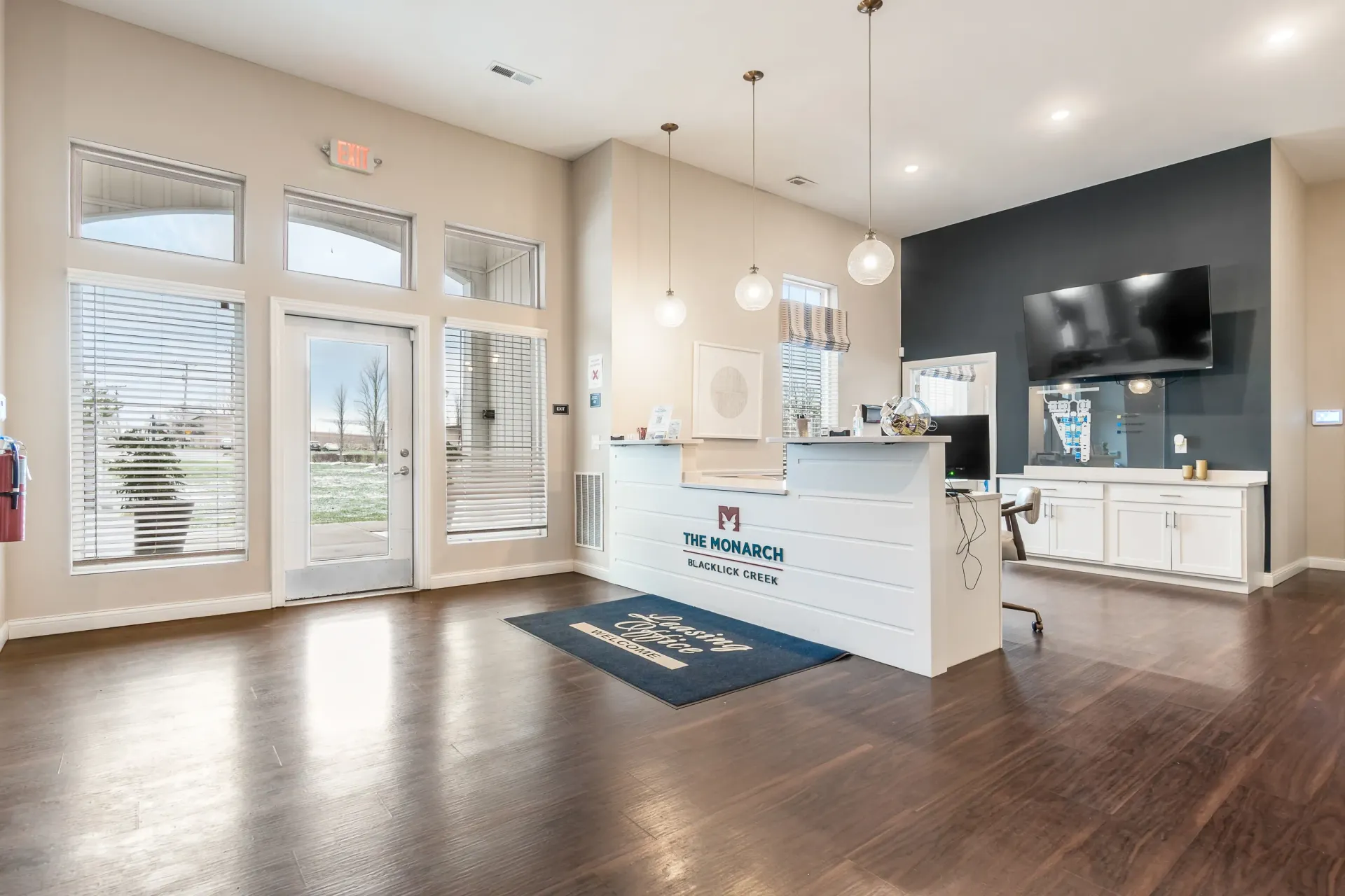 The Monarch Blacklick Creek leasing office reception desk and entrance.