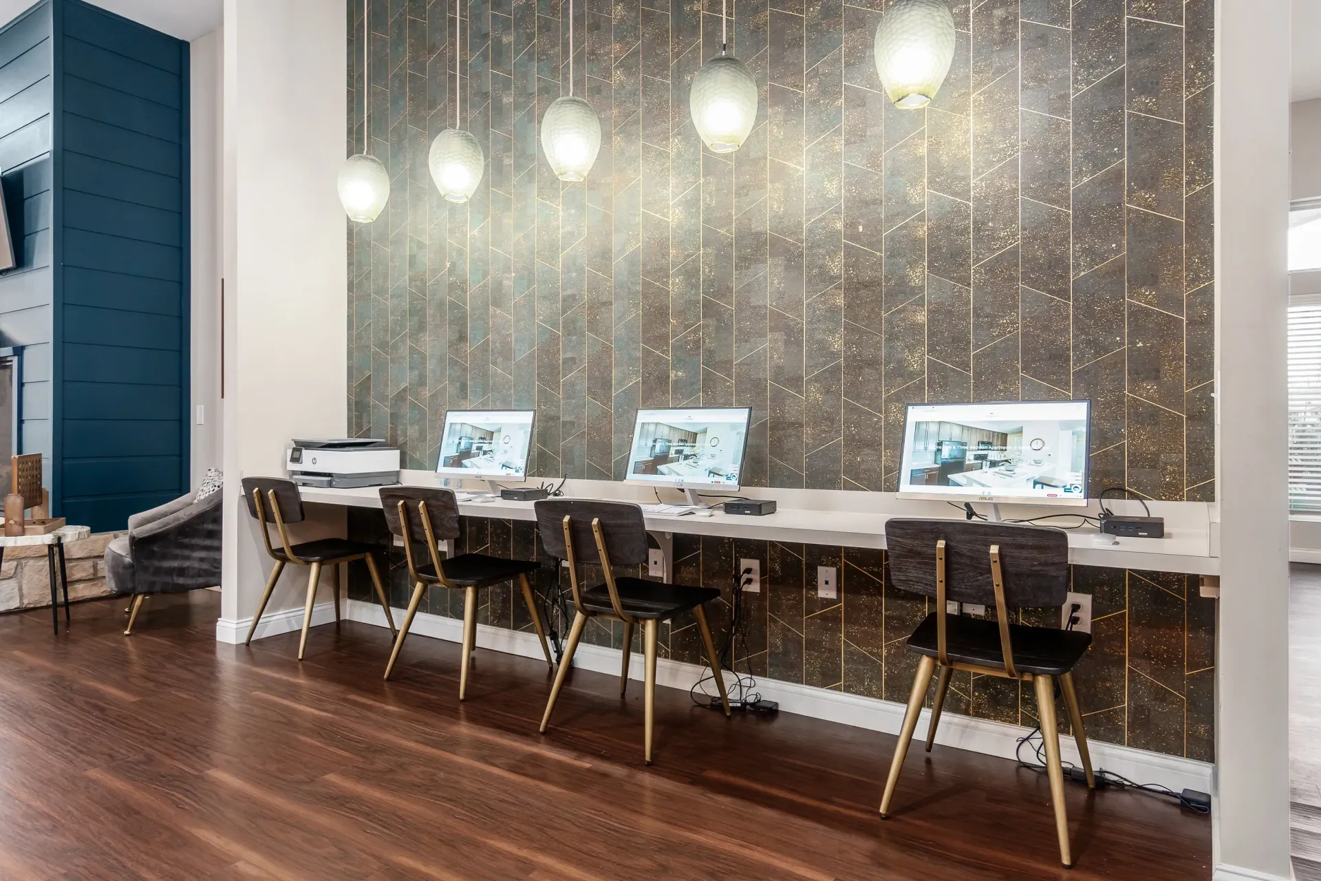 Business center with computers and a printer.