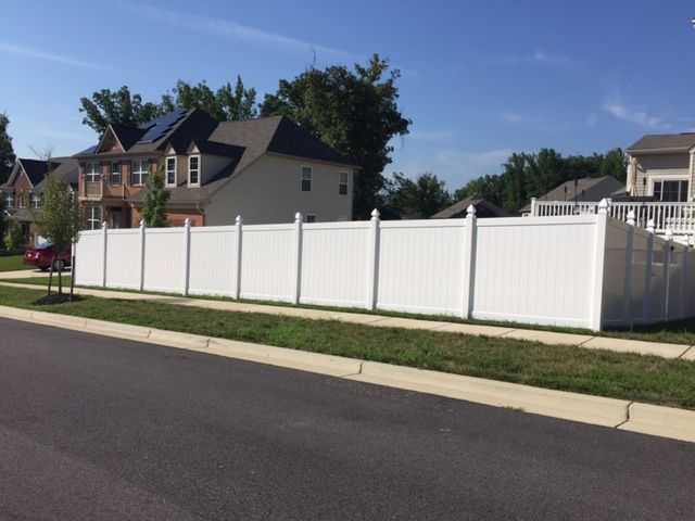 vinyl fencing installed along roadway