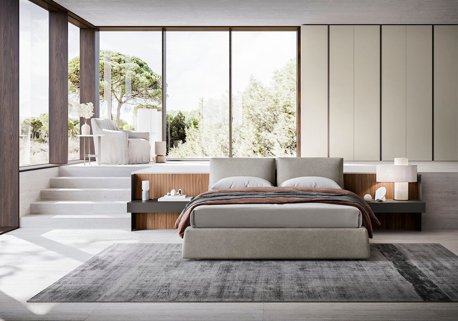 Camera da letto moderna con letto, tappeto e ampie finestre con vista sugli alberi.