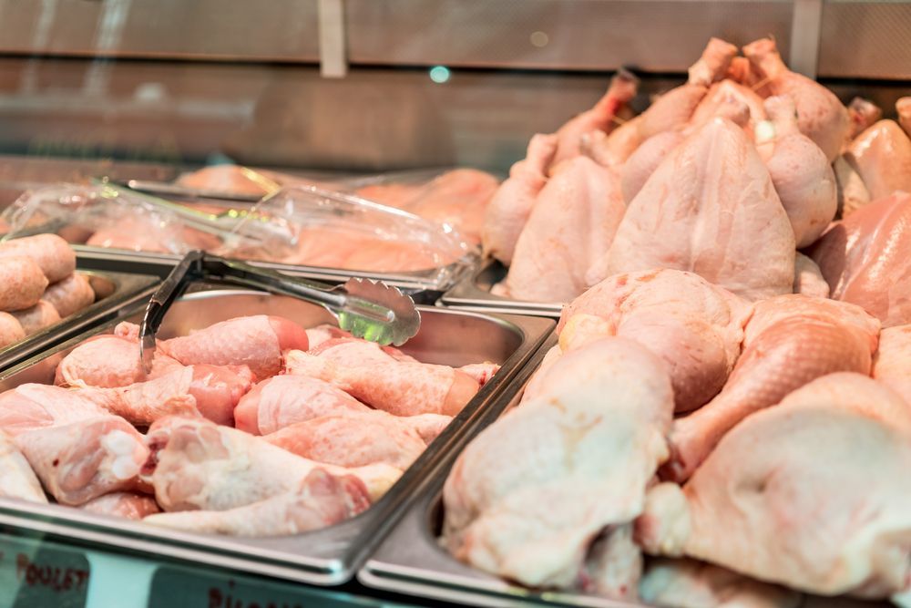 Raw Chicken Is Being Sold In A Butcher Shop — McGrath Meats In Taree, NSW
