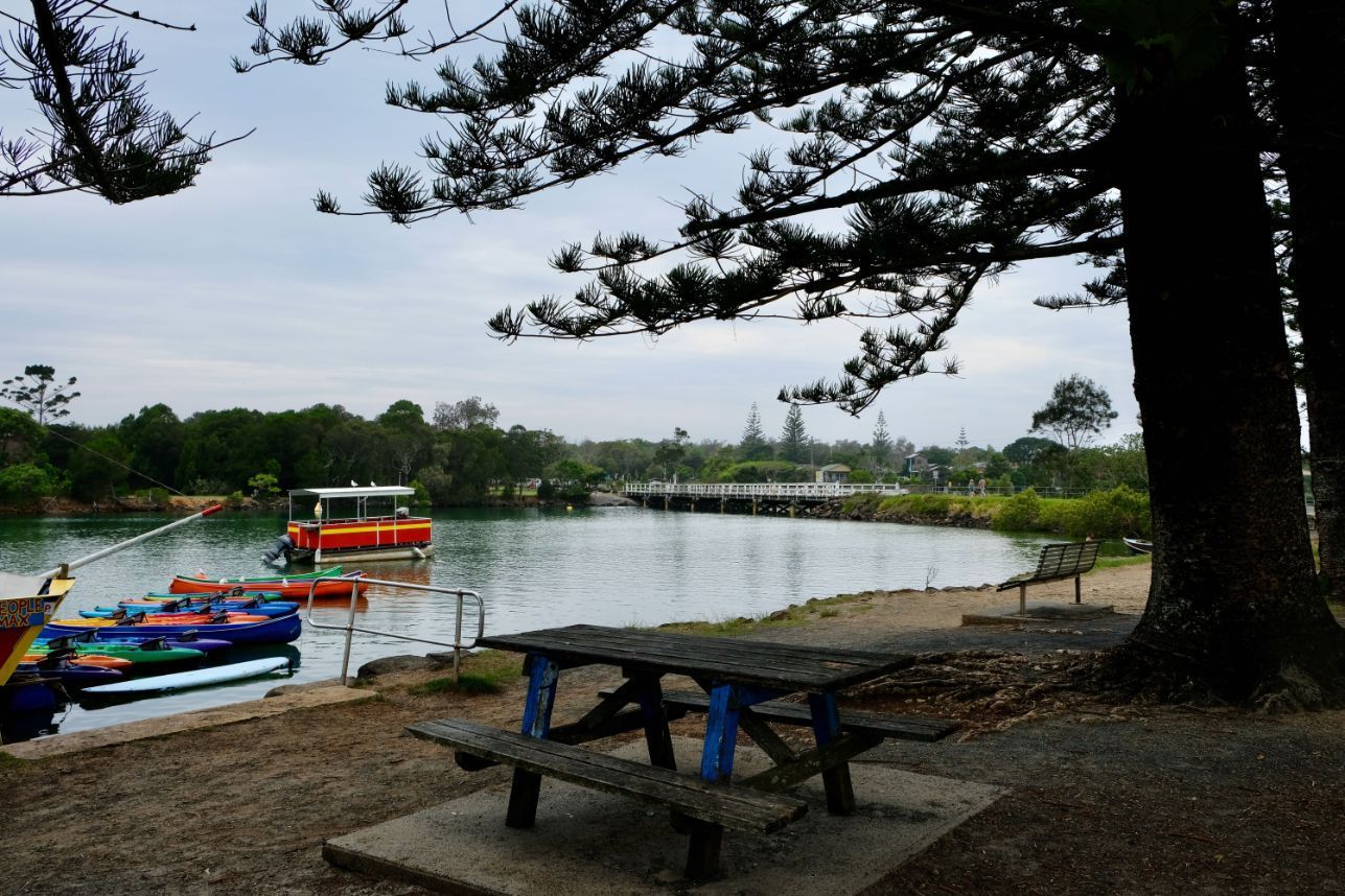 A picnic table in front of a body of water — Lennox Head Tree Care In Lennox Head, NSW