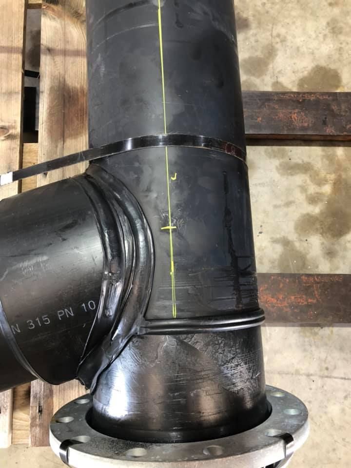 A Black Pipe Is Sitting on Top of A Wooden Pallet — Advanced Poly in Yarrawonga, NT