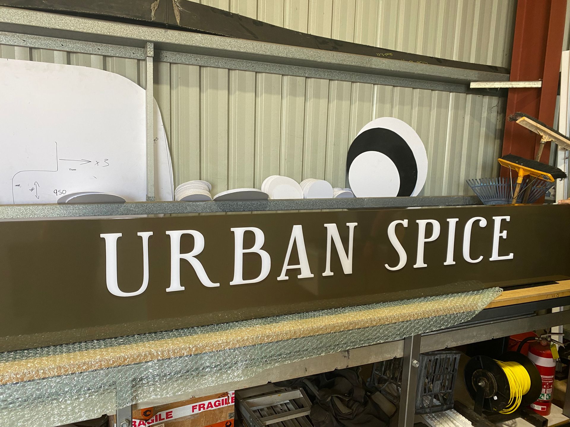URBAN SPICE sign on a shelf in a kitchen or pantry area — Advanced Poly in Darwin, NT — Advanced Poly in Darwin, NT 