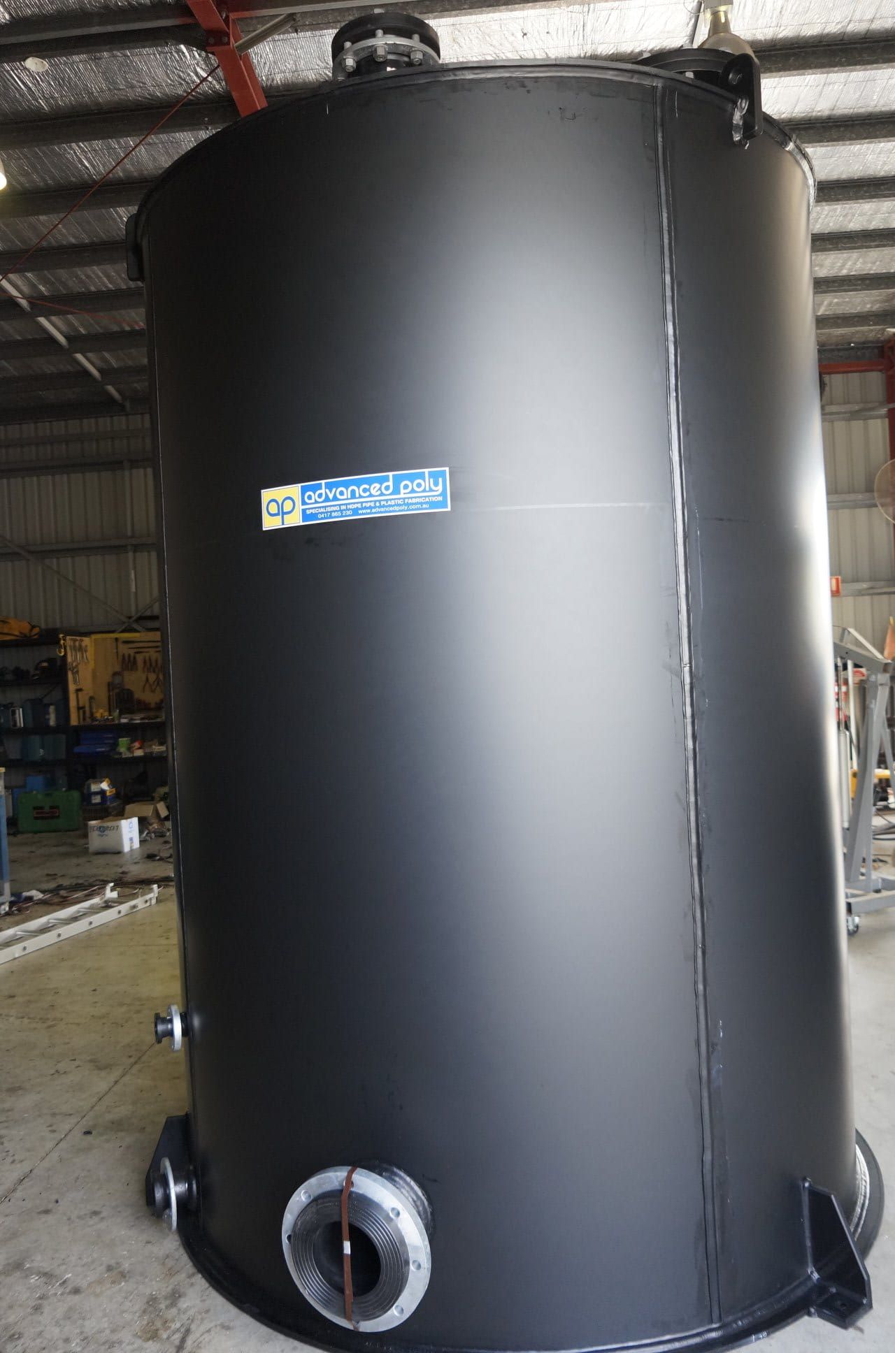 A large black tank is sitting in a warehouse. — Advanced Poly in Yarrawonga, NT