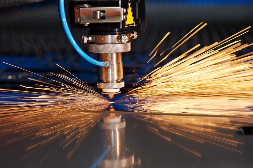 A Machine Is Cutting a Piece of Metal with Sparks — Advanced Poly in Yarrawonga, NT