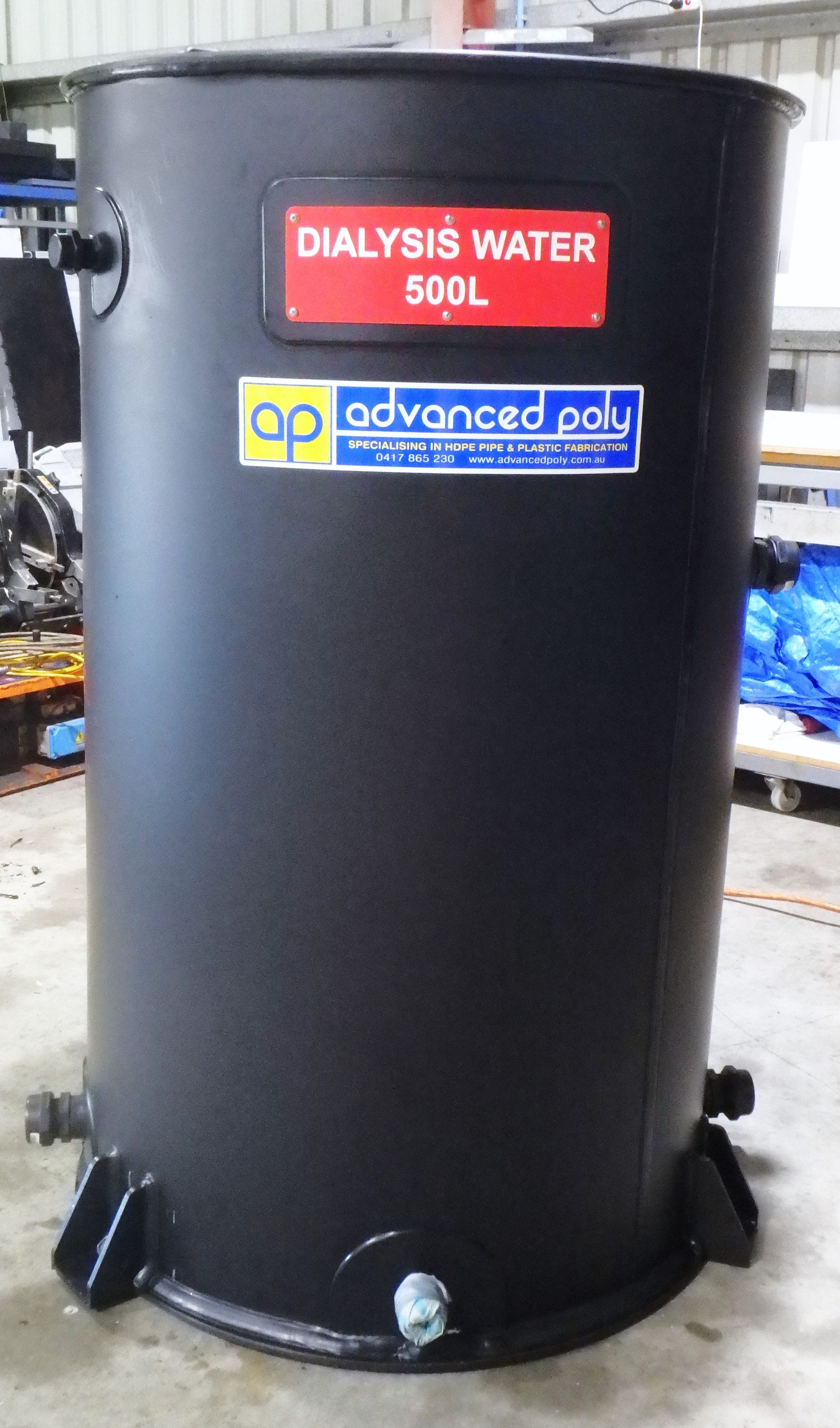 Black 500L dialysis water tank with labels in an industrial setting — Advanced Poly in Darwin, NT 