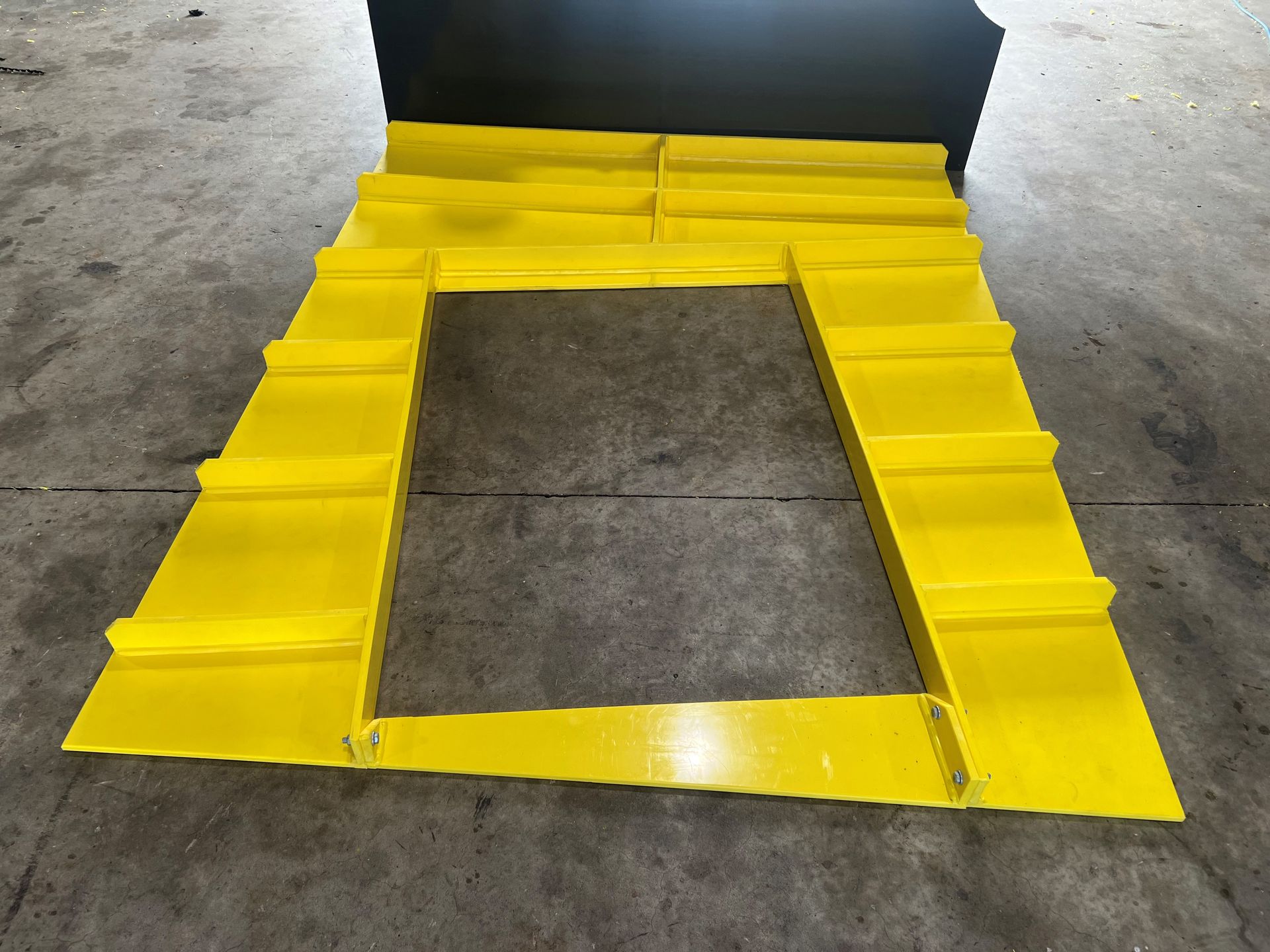 Yellow tape outlines a rectangular floor opening on a concrete surface. — Advanced Poly in Darwin, NT — Advanced Poly in Darwin, NT — Advanced Poly in Darwin, NT — Advanced Poly in Darwin, NT — Advanced Poly in Darwin, NT 