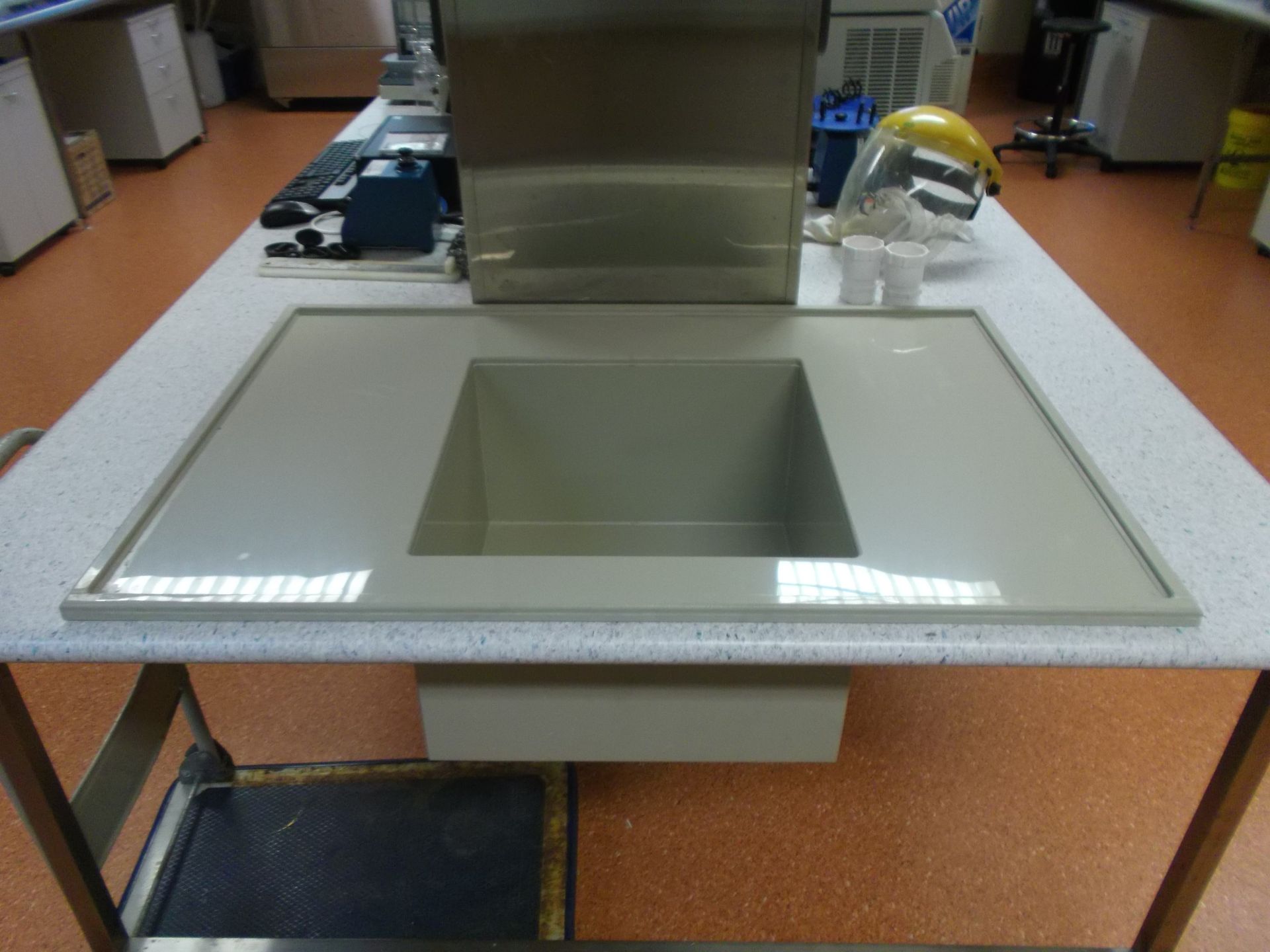 Modern restroom sink with large rectangular basin and chrome faucet on a speckled countertop — Advanced Poly in Darwin, NT