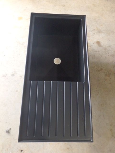 Black rectangular sink with ribbed draining board on a light surface. — Advanced Poly in Darwin, NT