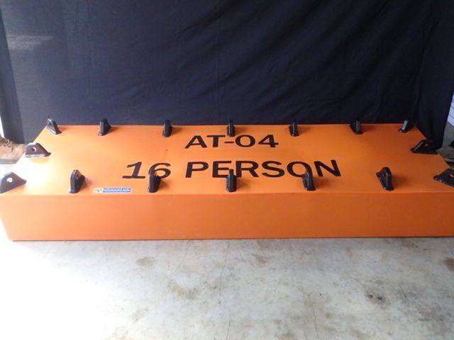 Orange rescue sled marked “AT-04 1 PERSON” on a concrete floor against a dark backdrop — Advanced Poly in Darwin, NT