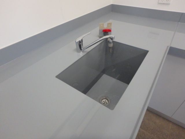 Gray laboratory sink with stainless-steel basin and faucet on a light countertop. — Advanced Poly in Darwin, NT