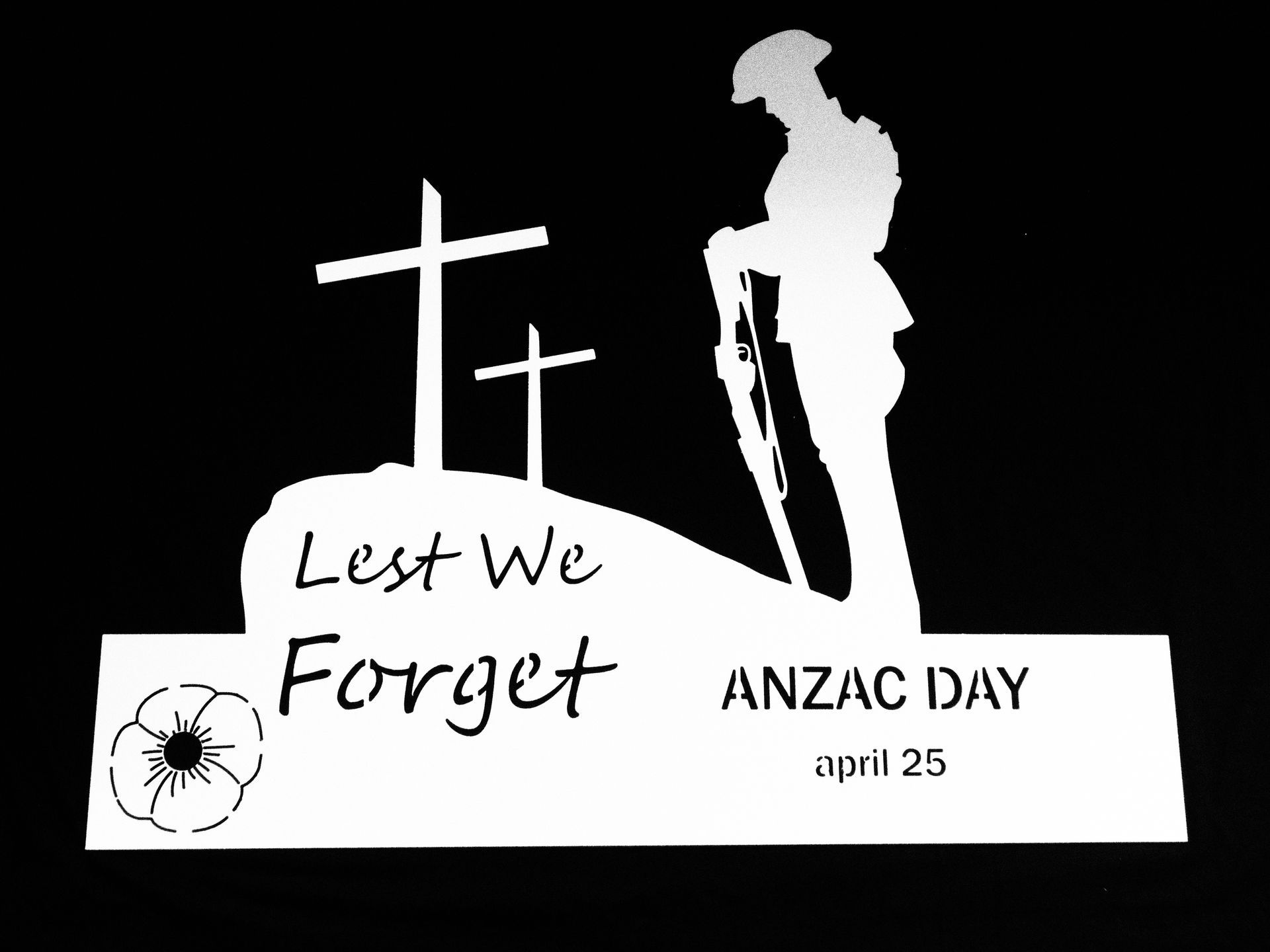 ANZAC Day memorial graphic with a cross, soldier silhouette, and “Lest We Forget” text on black background — Advanced Poly in Darwin, NT — Advanced Poly in Darwin, NT 