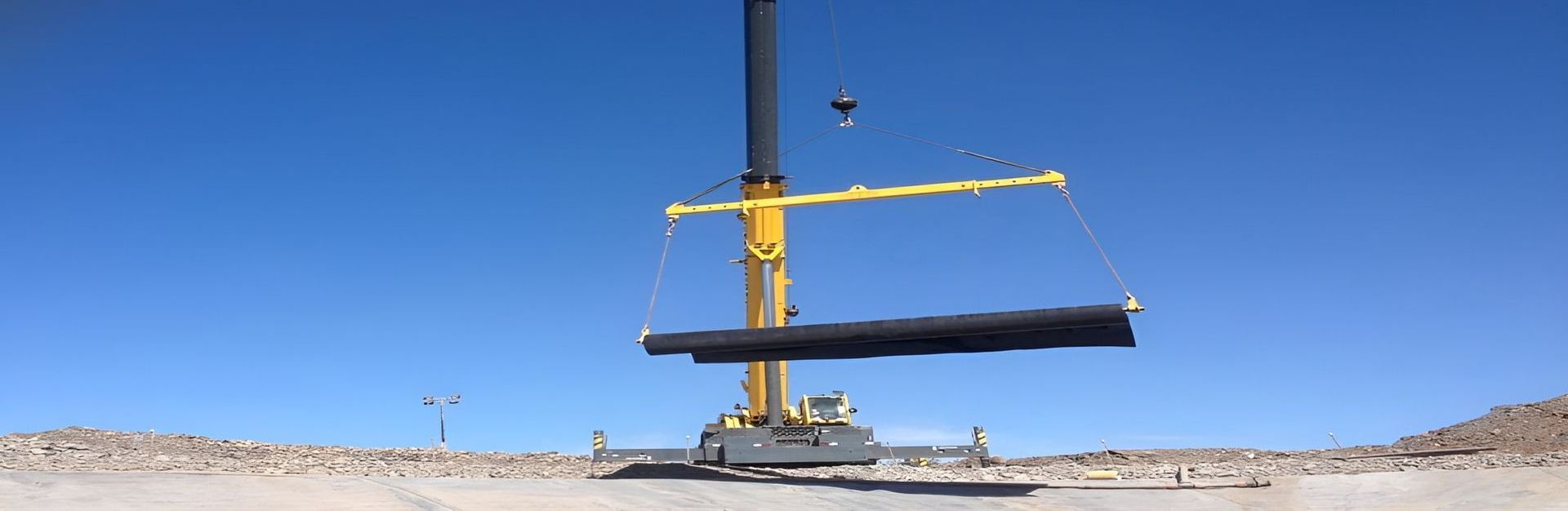 A Large Pipe Is Being Lifted by A Crane — Advanced Poly in Yarrawonga, NT