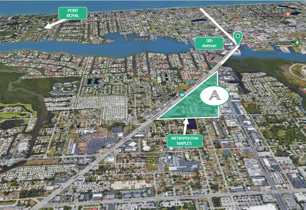 An aerial view of a city with a green triangle in the middle.