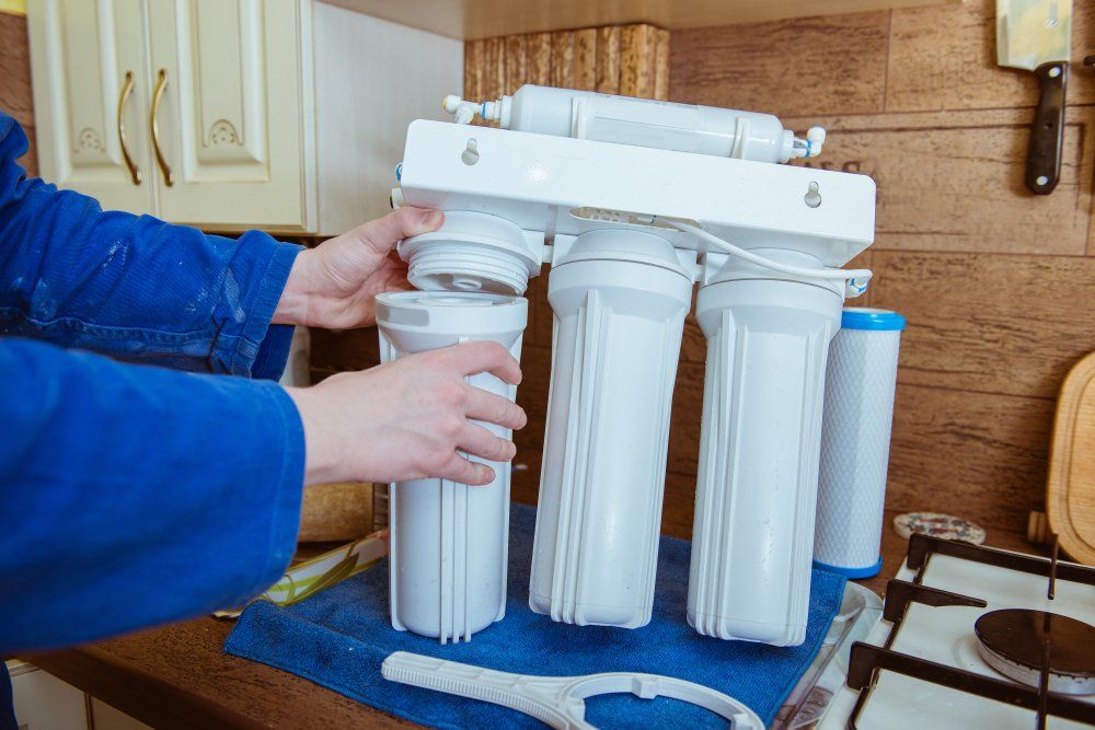 Installing Water Filter — Farm Equipment Experts In Mullumbimby, NSW