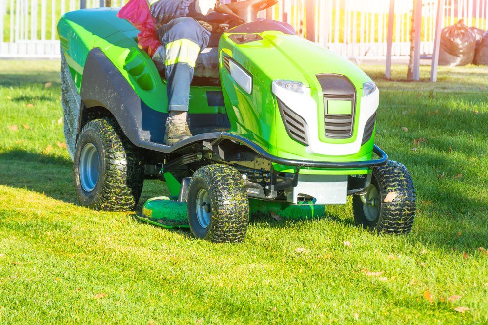 A Man Riding On Mower — FarmCare in Mullumbimby, NSW