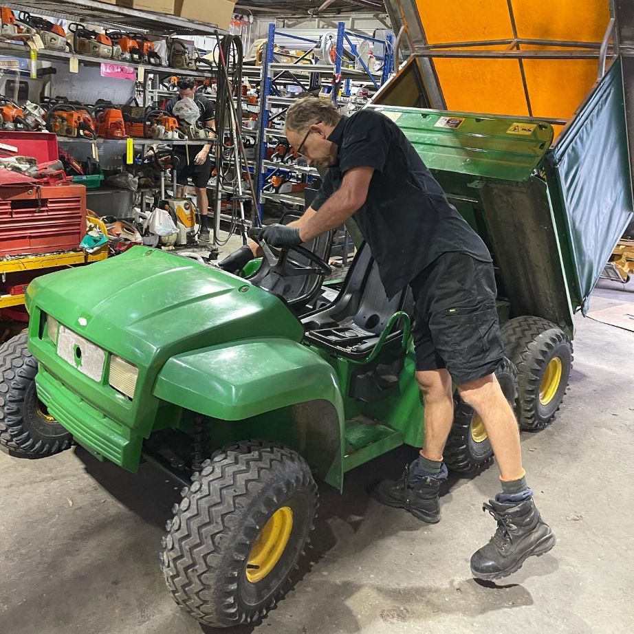 Man Repairing John Deere Mower — FarmCare In Byron Bay, NSW