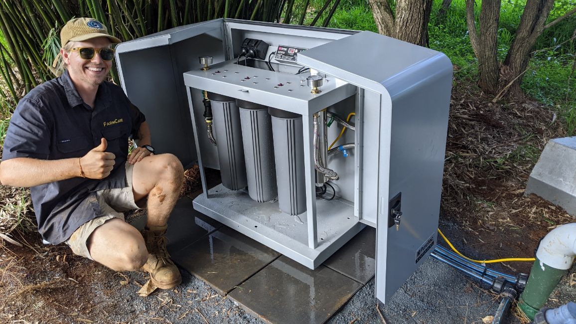 FarmCare Employee Working on Water Filter — FarmCare In Ballina, NSW
