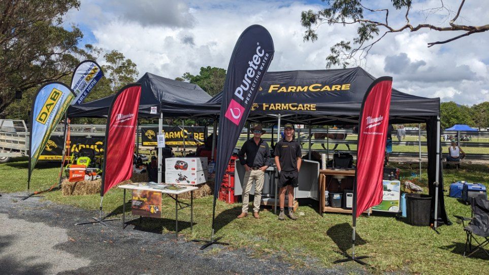 A Group of People Standing in Front of a Tent — FarmCare in Mullumbimby, NSW