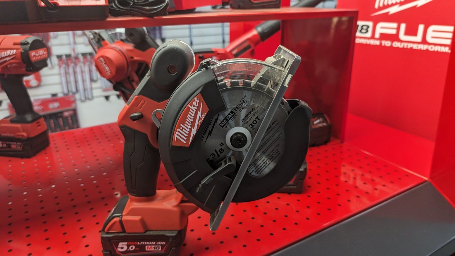 A Milwaukee Circular Saw is Sitting on Top of a Red Table — FarmCare in Mullumbimby, NSW