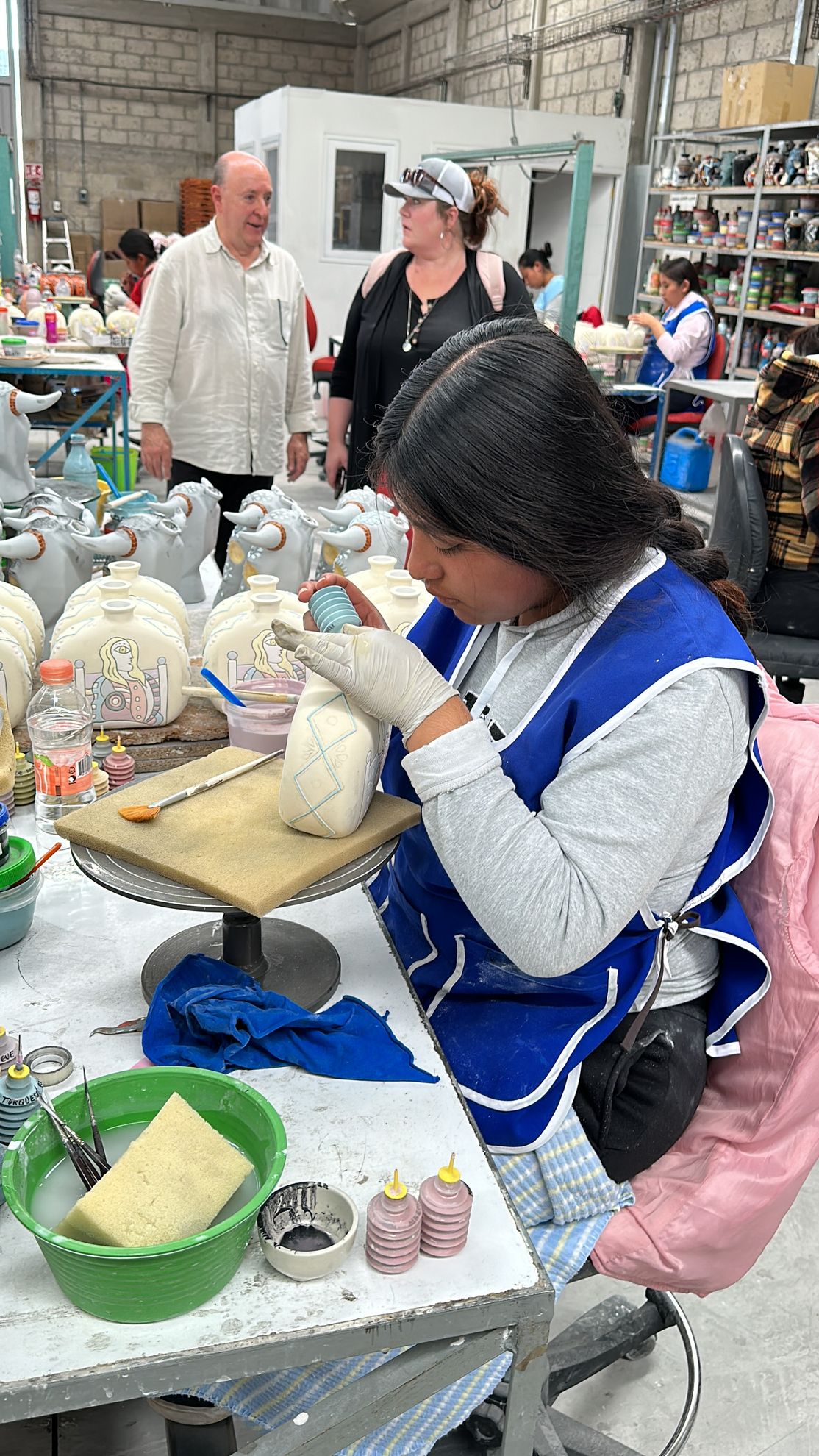 mexican artisan handpainting bottle azulejos tequila