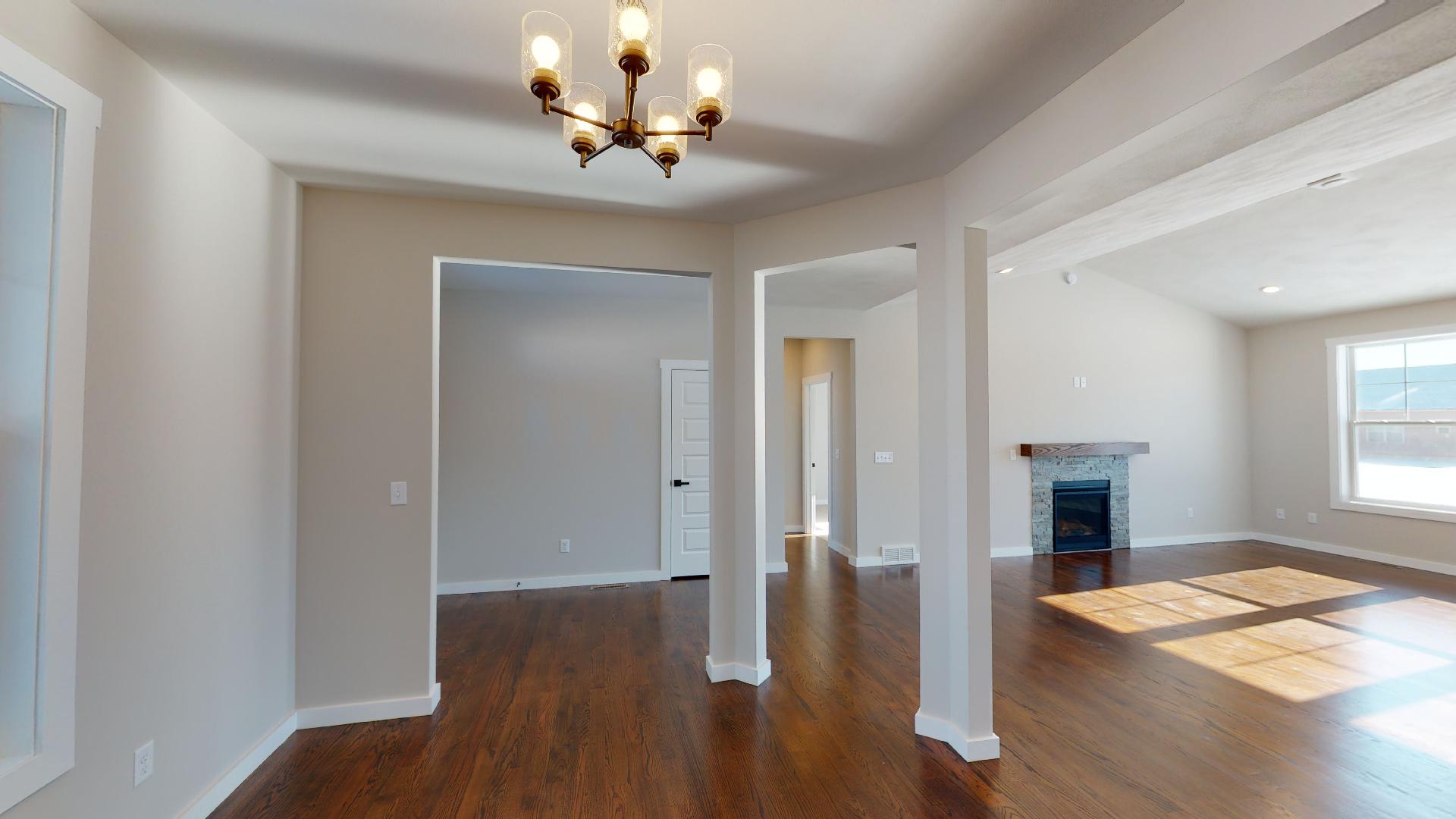 dining room with front entryway and living room in background