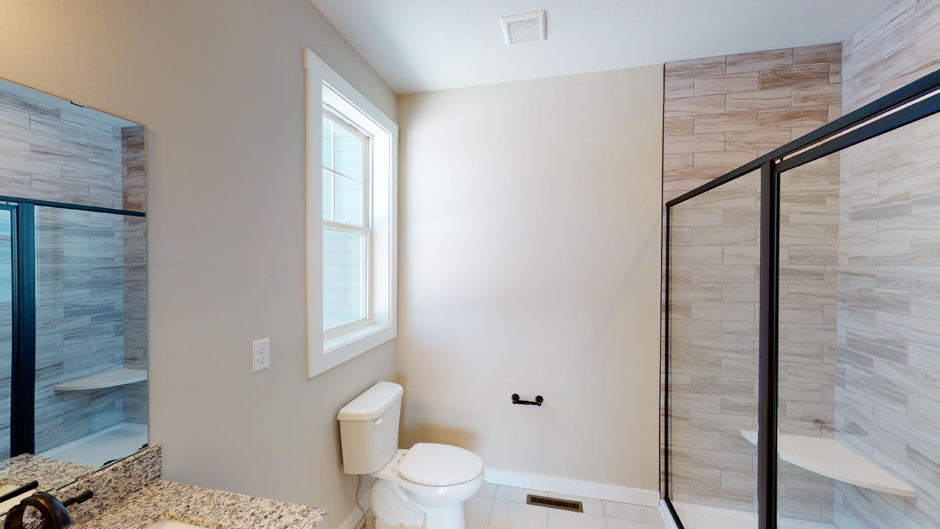 toilet and tile shower